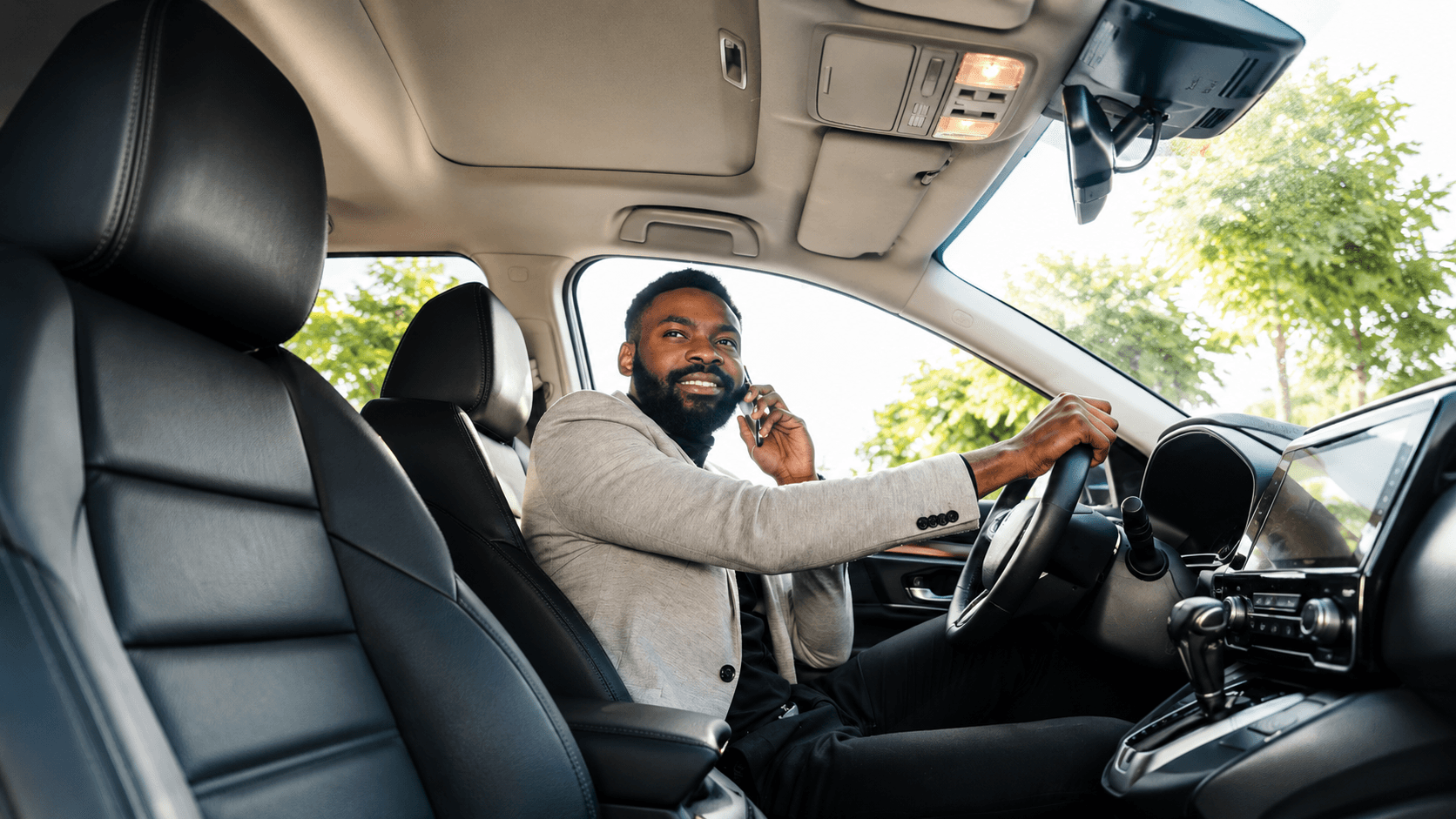 Photo - driver taking a call from the driver's seat